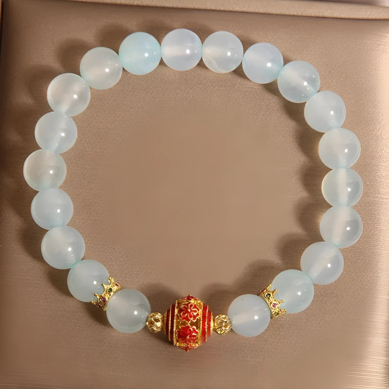 Women's blue agate and crystal bracelet with colourful lucky beads on a wrist.