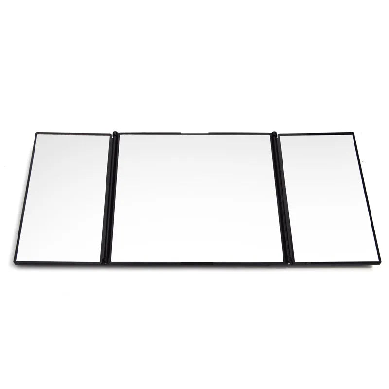 Silver folding car makeup mirror shown both closed and open on a car visor.
