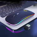 White luminous wireless mouse with glowing blue scroll wheel on a wooden desk