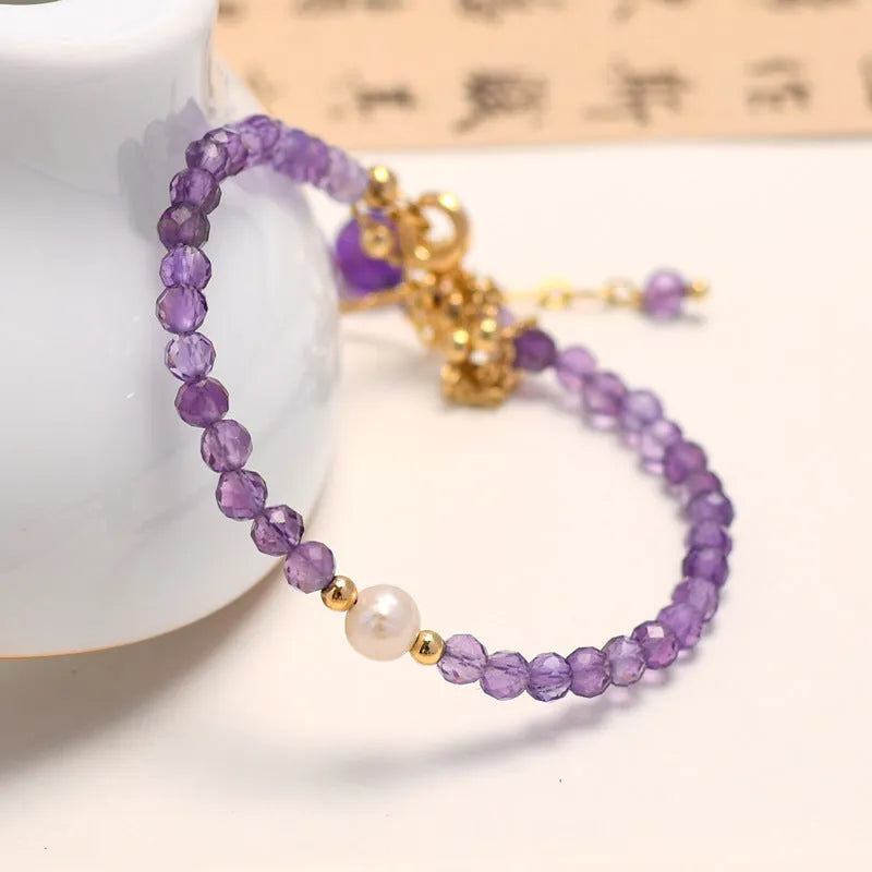 Women's amethyst bracelet with genuine pearls and crystal stones in Chinese-style design