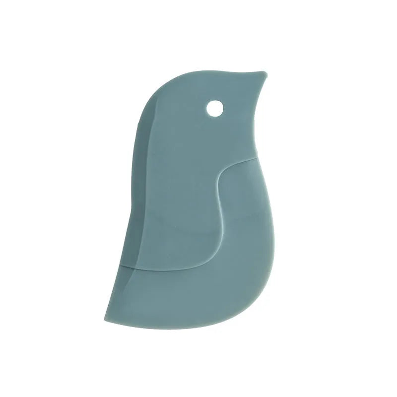 Penguin-shaped soft blade kitchen scraper tool for cleaning plates and pans in green, grey, or pink colours