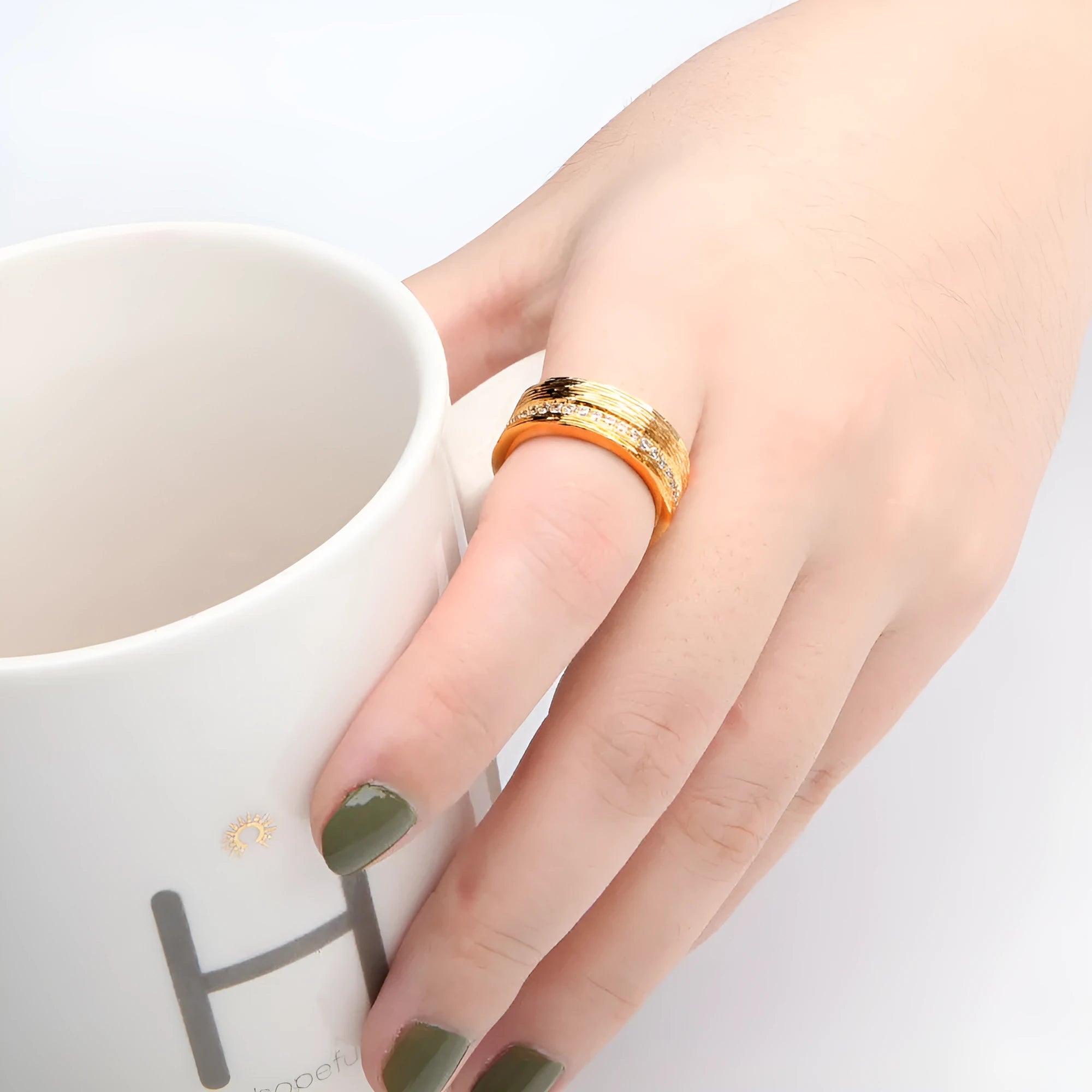 Gold geometric zircon women's ring on a white background.