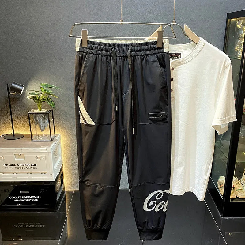 Black men's cropped casual trousers with ankle banding made from ultra-thin ice silk and cotton.