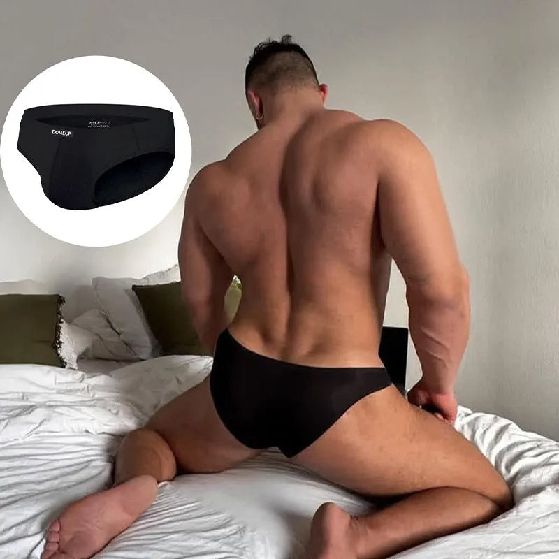 Men's solid colour low waist seamless briefs in white, black, and pink on a size chart.
