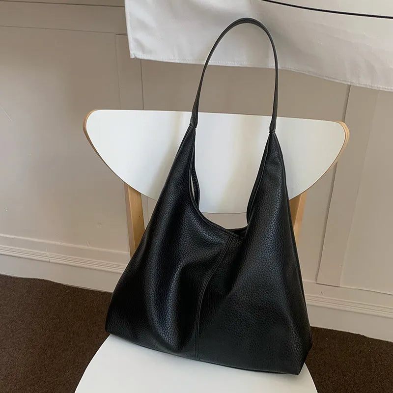 PU leather casual armpit bag for women, high capacity tote in black solid colour