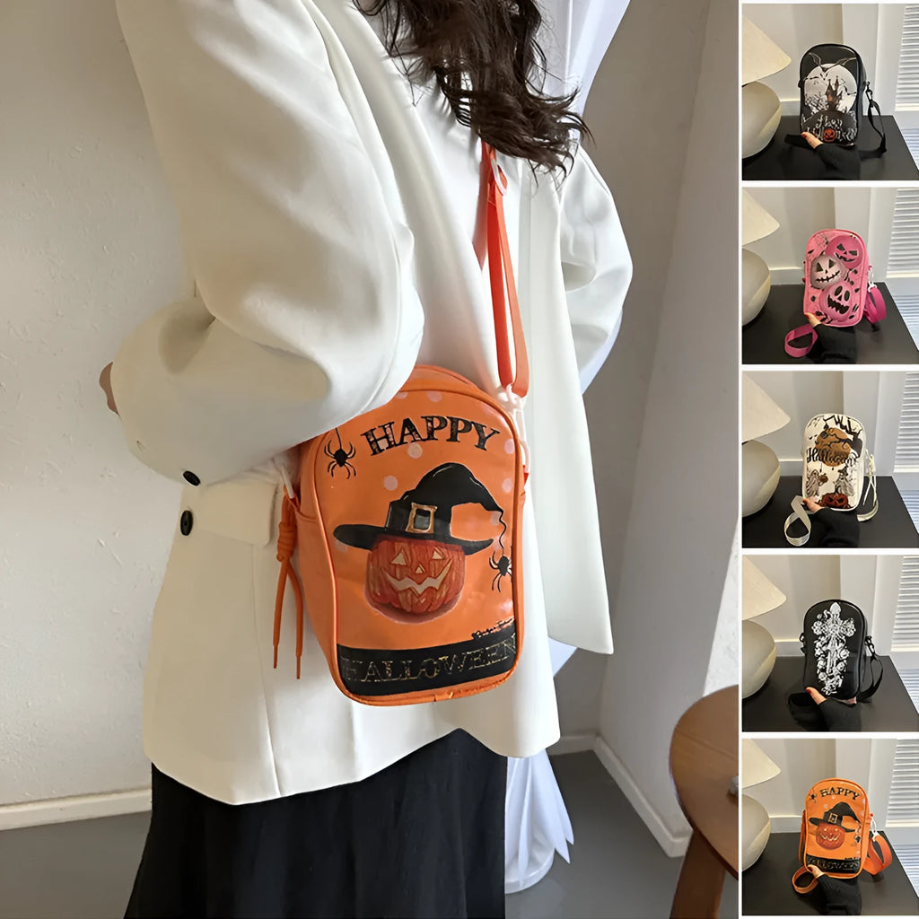Black Halloween crossbody bag with orange pumpkin, white ghost, and black bat print, showing front zip and adjustable strap.