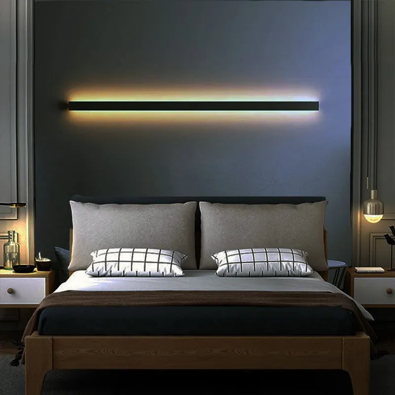 Black minimalist bedside wall lamp in 40cm to 200cm lengths with three light colour options on a wall