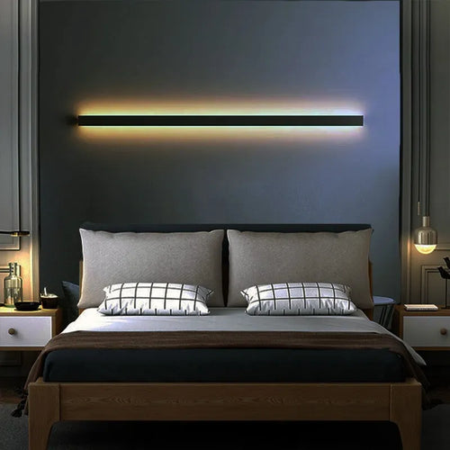 Black minimalist bedside wall lamp in 40cm to 200cm lengths with three light colour options on a wall