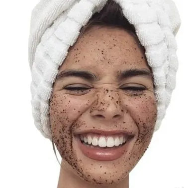 Coconut Oil Coffee Scrub Exfoliating Deep Cleansing Granules in a bowl with coffee grounds and coconut oil