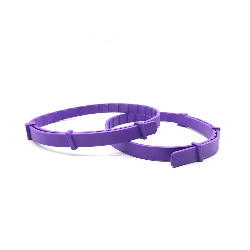Four monochrome dog calming collars in assorted colours, adjustable up to 62cm for anxiety relief.