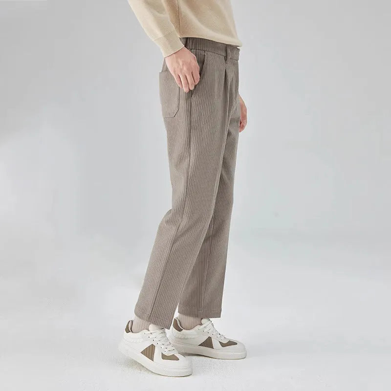 Men's straight-leg corduroy trousers in black, beige, and brown grey colours showing loose fit and textured fabric