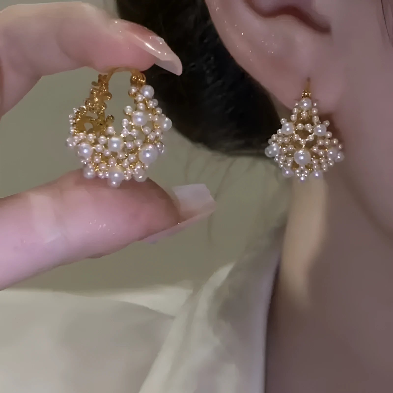 Gold tone women's flower basket earrings with small rice-shaped beads and pearl inlay detail