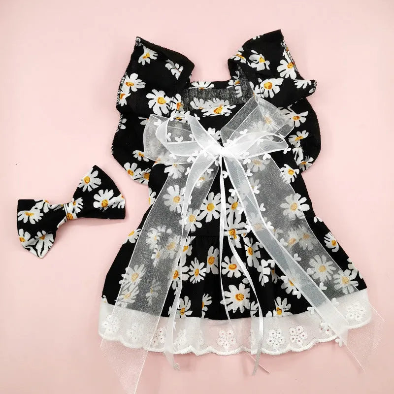 Breathable lace and plaid gauze dog skirt in Pink Daisy with matching bow necklace on a small dog