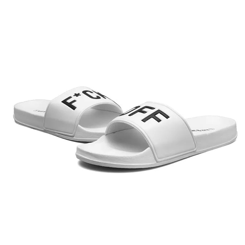 A pair of open-toe men's slippers with a rubber sole, shown in black and white colour options.