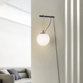 Clear glass Nordic wall lamp with three light colour options on white wall