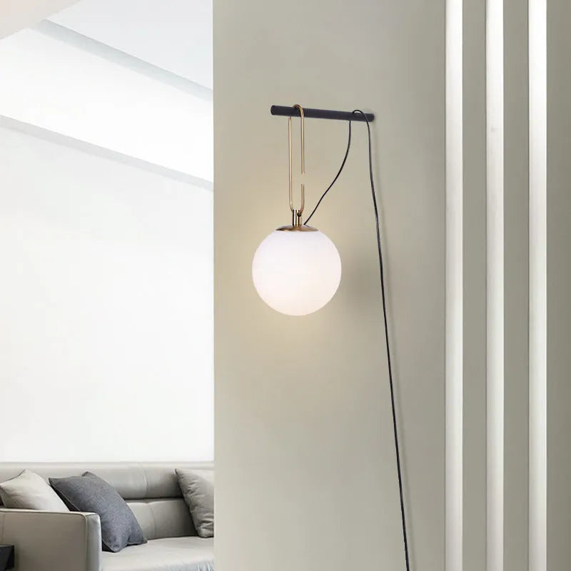 Clear glass Nordic wall lamp with three light colour options on white wall