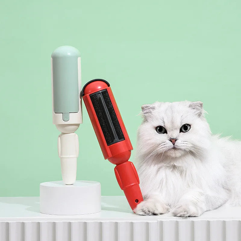 White and green pet hair removal roller with self-cleaning base on a carpet