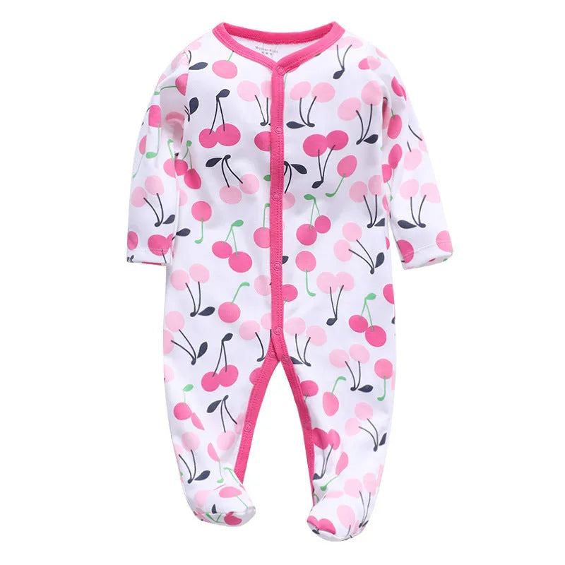 Soft cotton baby one-piece bodysuit in blue and green dinosaur print, size 6M, front view on white background