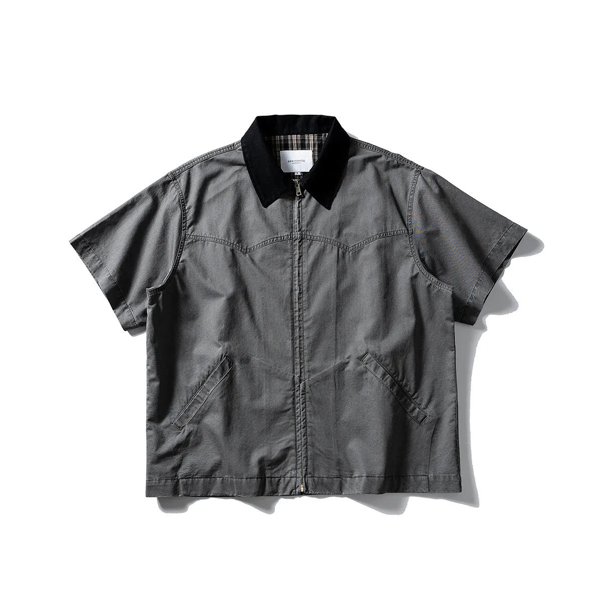 Grey loose-fit short-sleeved cardigan-style overalls shirt on a hanger.