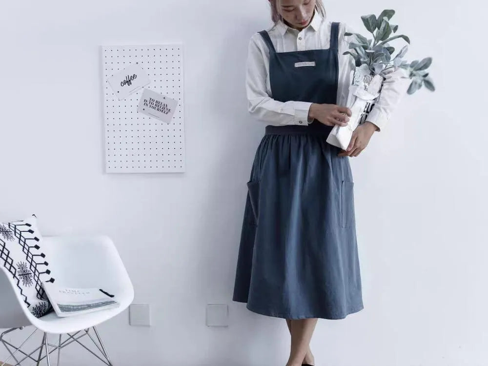 Cotton plain sleeveless kitchen apron in blue colour on white background