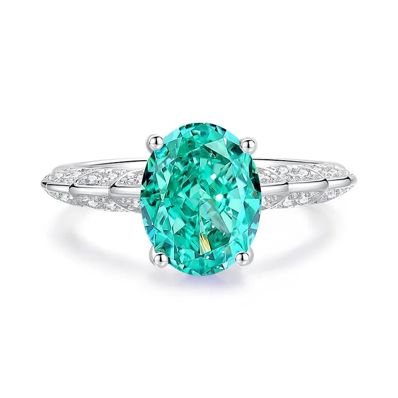 S925 sterling silver women's ring with ellipse emerald and inlaid high carbon diamond in geometric setting.