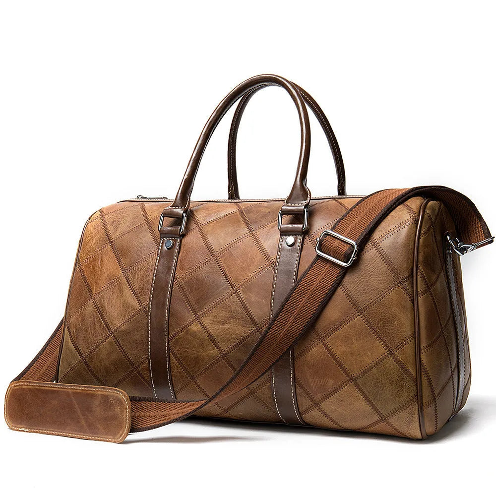 Vintage brown cowhide leather duffel bag with a single strap and internal organiser pockets.