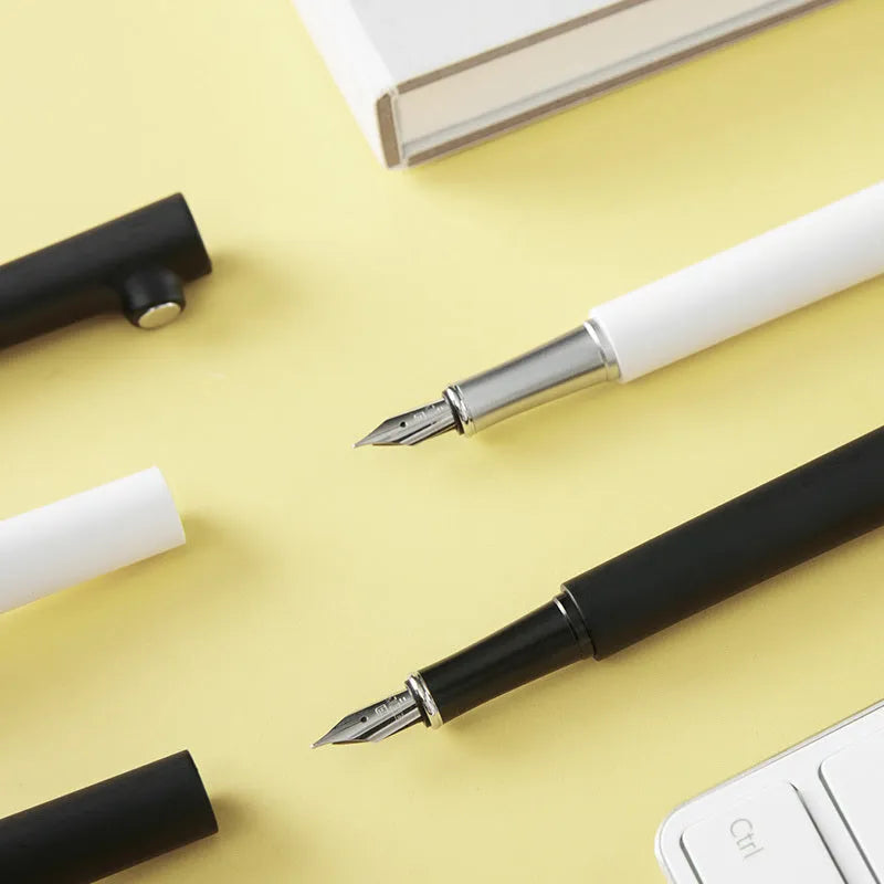 Red Dot Award fountain pen with 0.7mm stainless steel nib in black or white resin holder.