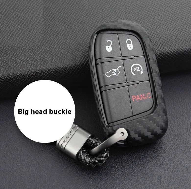 Carbon fibre pattern silicone protective case covering a Dodge, Chrysler, and Fiat car key fob