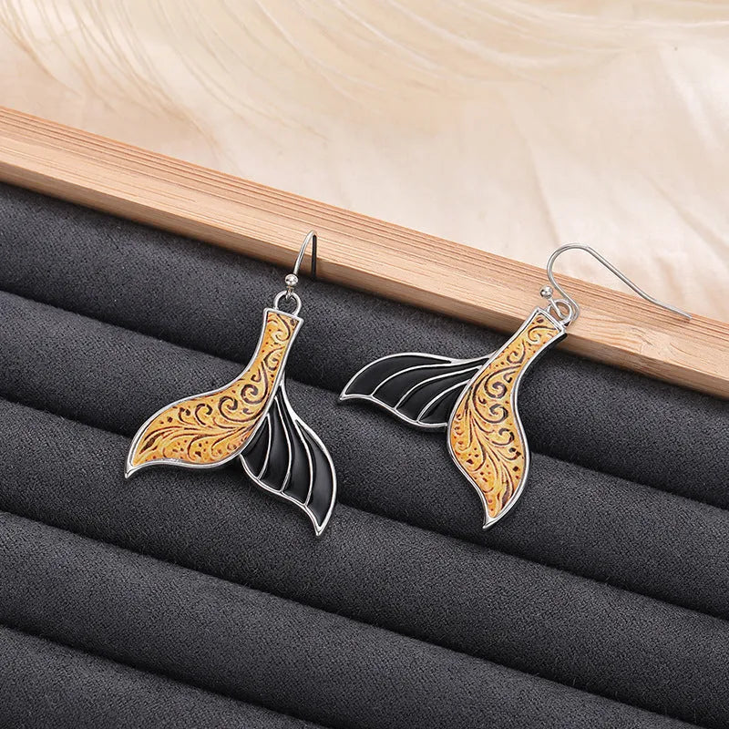 Women's white gold colour alloy fishtail earrings with whale design and retro styling