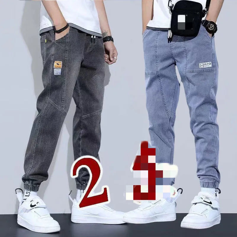 Two pairs of women's casual cotton jeans with mid waist and washed finish in grey and black