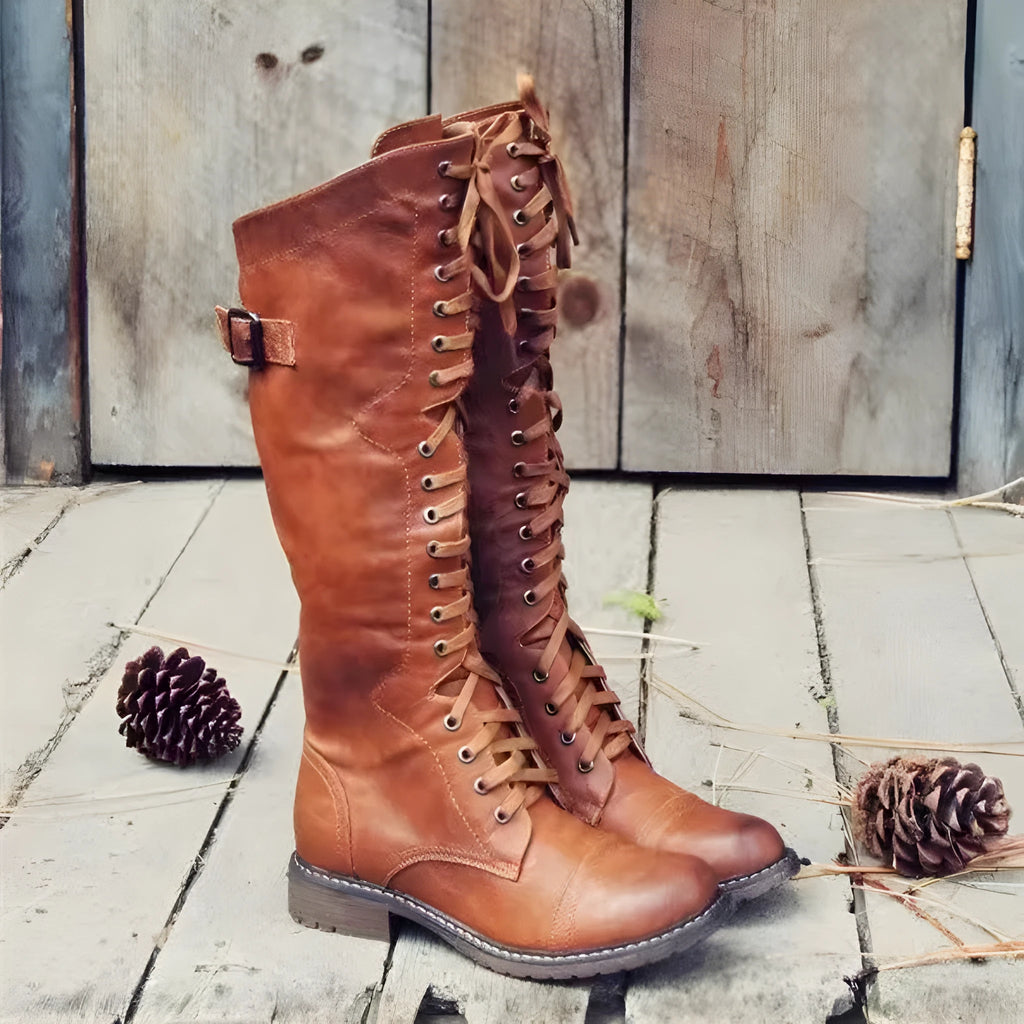 Black women's high leg boots with a low chunky heel and round toe made from artificial PU.