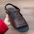 Men's black embroidered floral beach sandals with a flat heel on a white background.