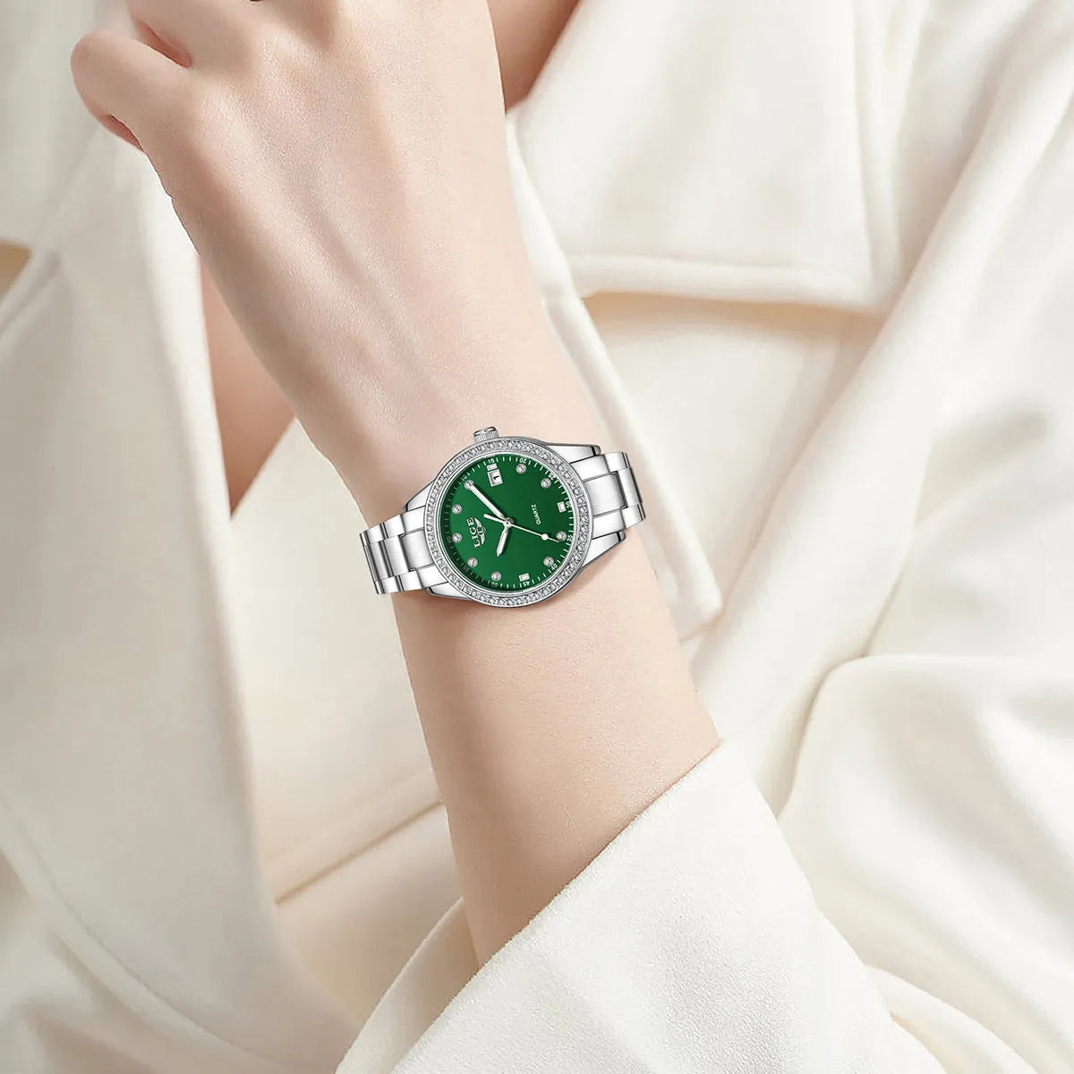 Silver Fashion Girl watch with round diamond-encrusted dial on stainless steel strap, showing luminous hands.
