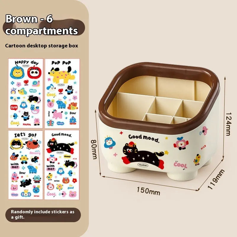 Cartoon-style plastic desktop organiser with grid compartments and red or brown stickers.