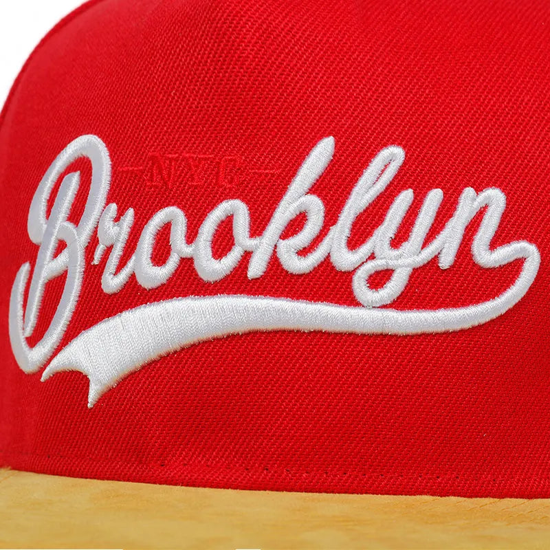 Red and black cotton adjustable baseball cap with embroidered letter pattern and short brim