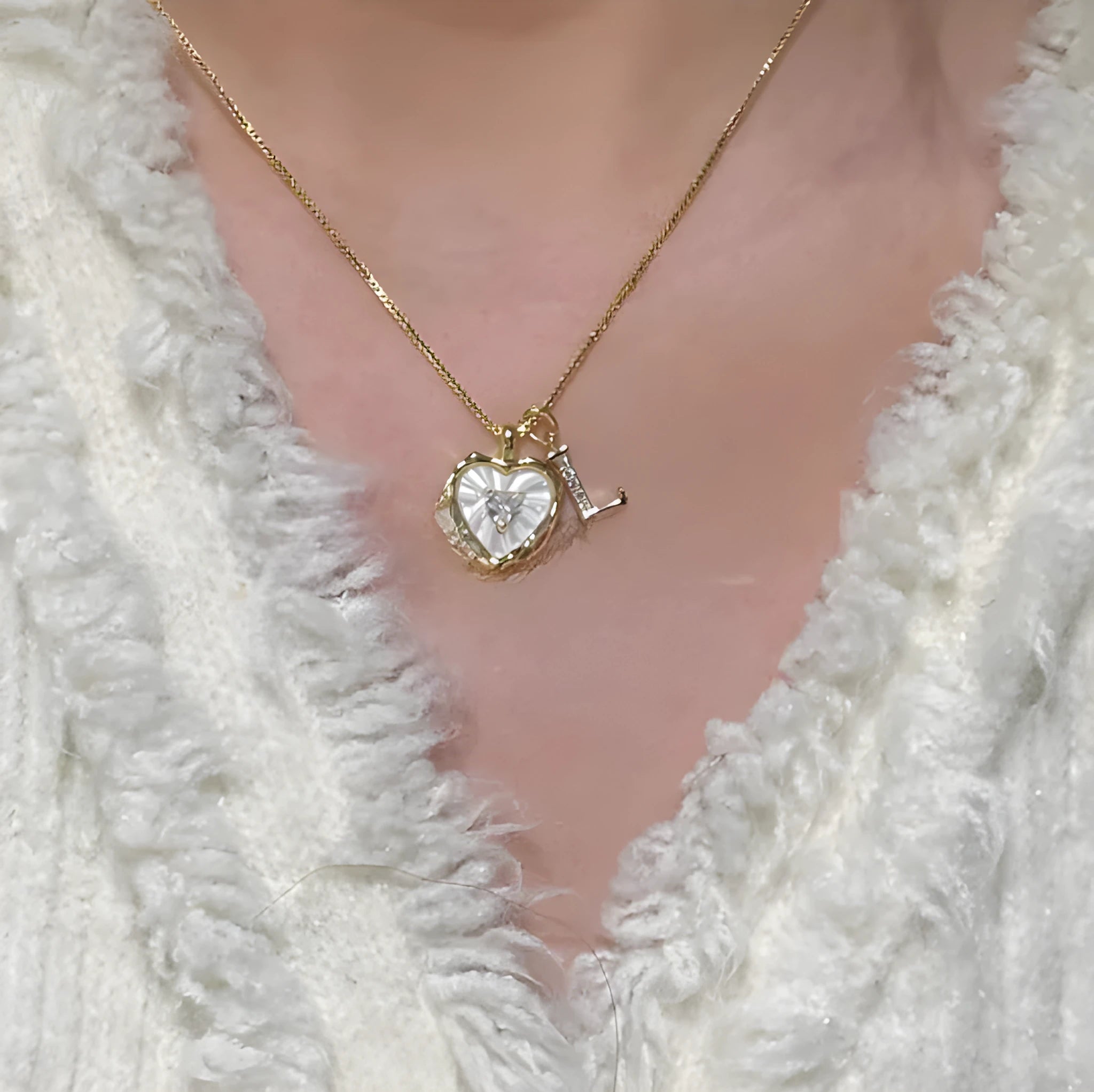 Women's pendant necklace with titanium steel chain and natural mother-of-pearl in heart-shaped design