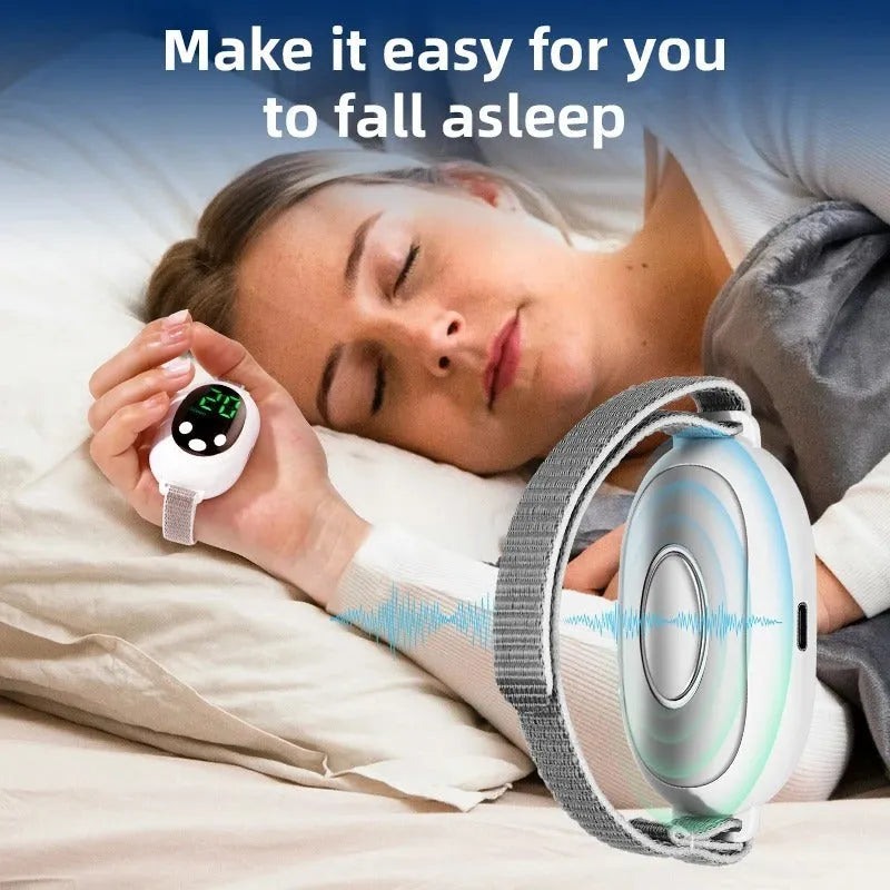 White handheld sleep aid remote control device with charging cable and wristband.