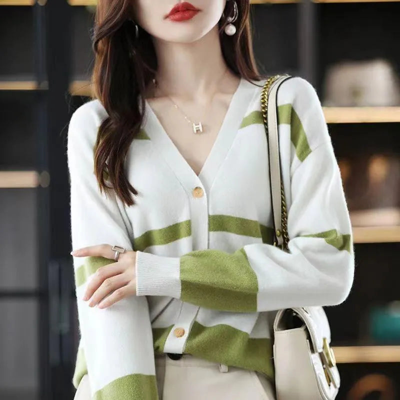 Women's slim fit V-neck cardigan with a raised 3D striped knit pattern in black and white.
