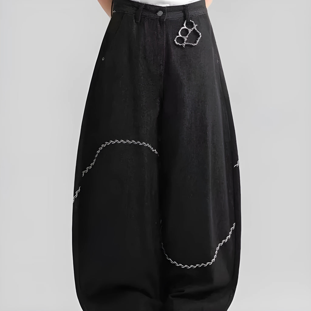 Black straight-leg denim trousers with a mid-waist fit and micro-elastic waistband on a hanger.