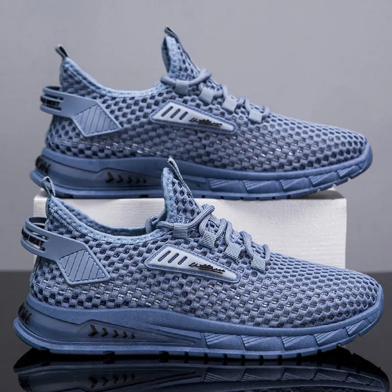 Men's beige mesh sneakers with lace-up front and synthetic leather upper on a white background.
