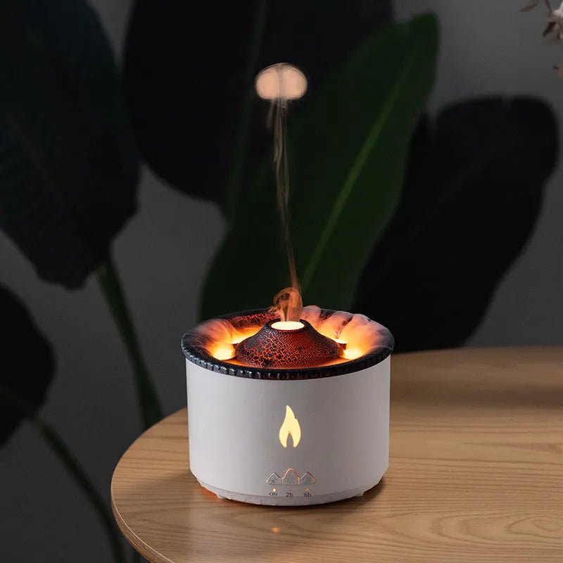 White flame and blue volcano humidifier diffuser with remote control on a table