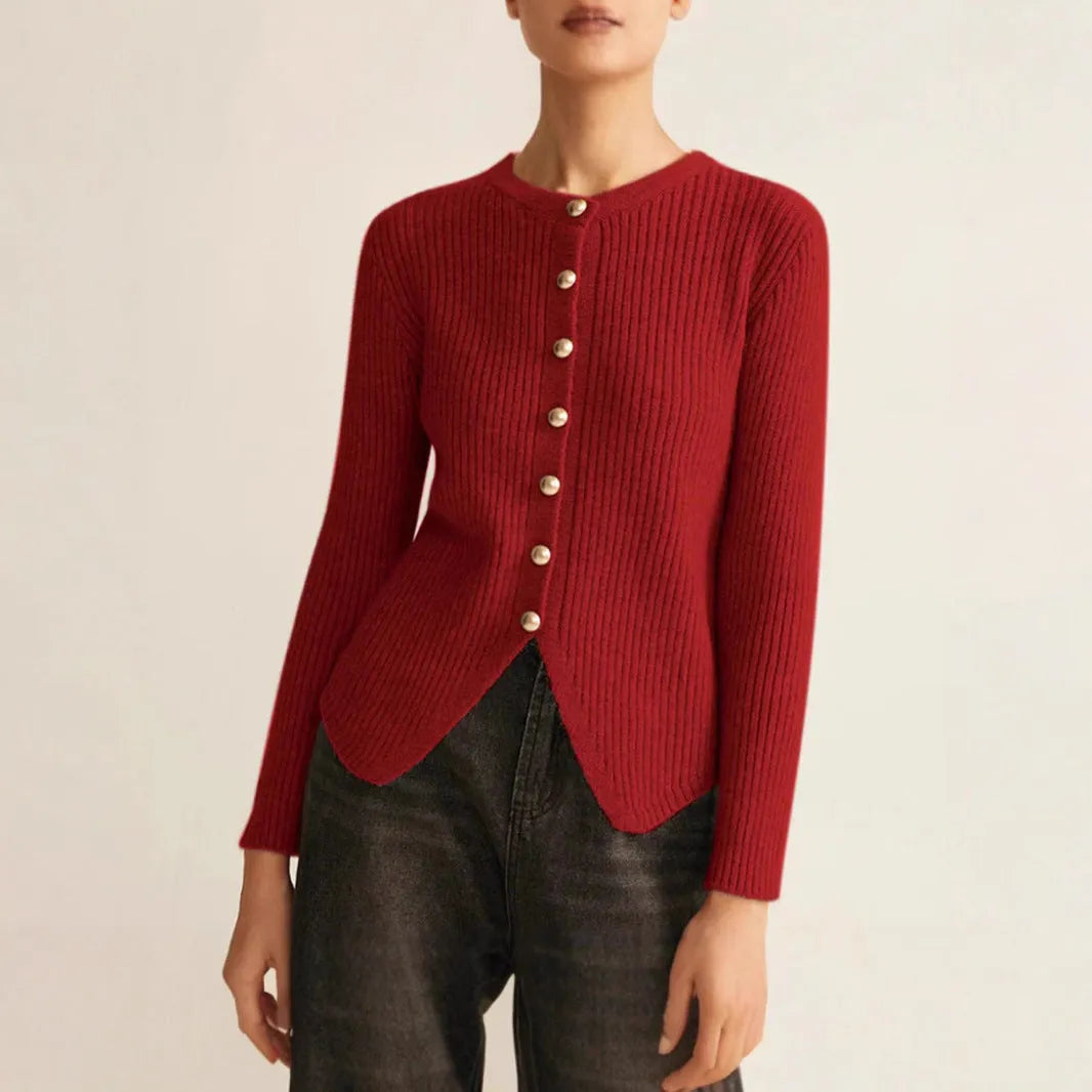 Red loose-fit cardigan sweater with a yarn collar on a hanger