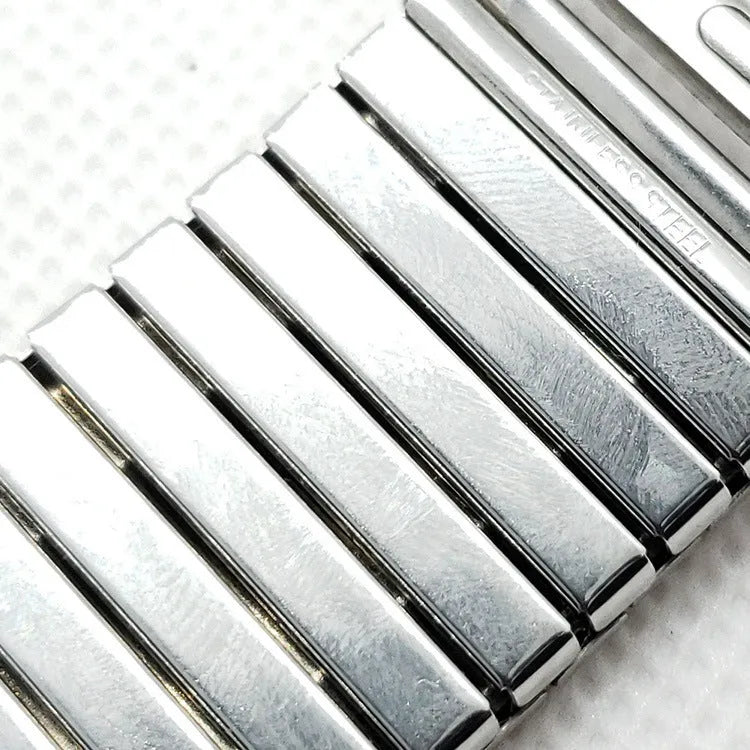 Silver stainless steel elastic Apple Watch band on a wrist, compatible with 38mm to 44mm cases