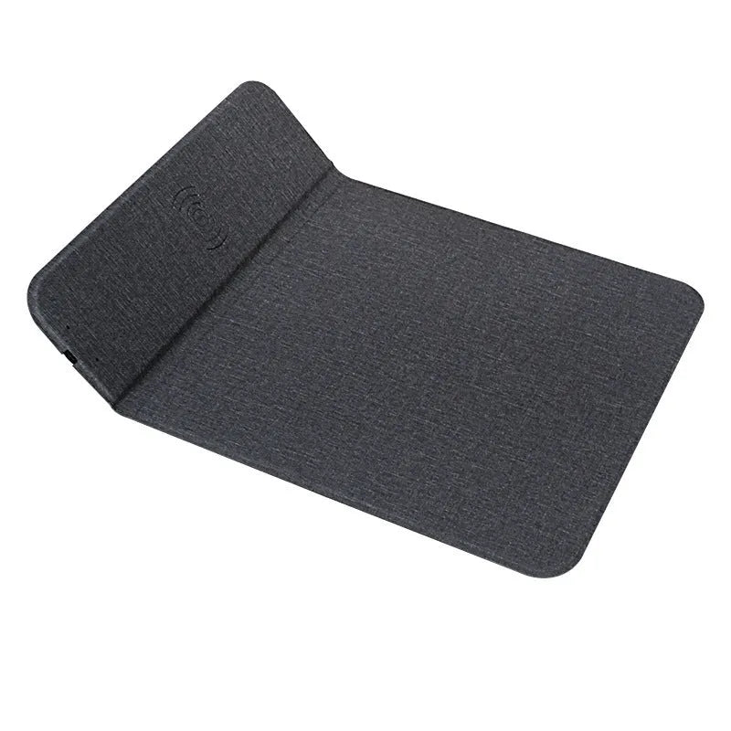Grey foldable cloth phone holder with integrated wireless charger, showing a mobile phone standing on it at an angle.