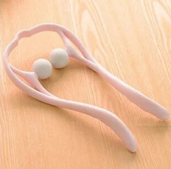 Blue plastic handheld neck and shoulder massager with adjustable stand and removable soft head on a white background.