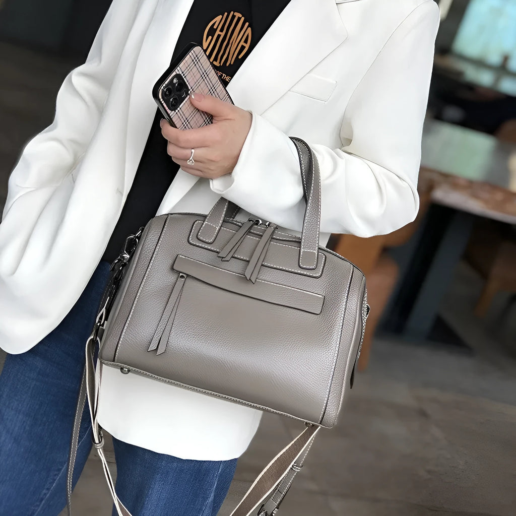Genuine cowhide leather messenger bag with lychee pattern texture in horizontal square shape showing internal compartments