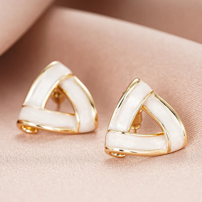 Women's metal oil stud earrings with inlaid zircon, geometric triangle shape, yellow gold finish on copper