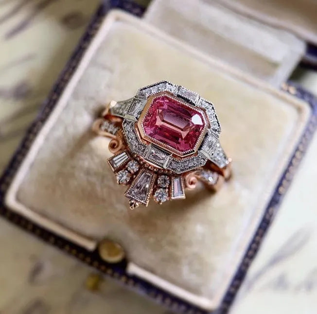 Rose gold alloy women's ring with a geometric shape and ruby-style decoration in a retro design.