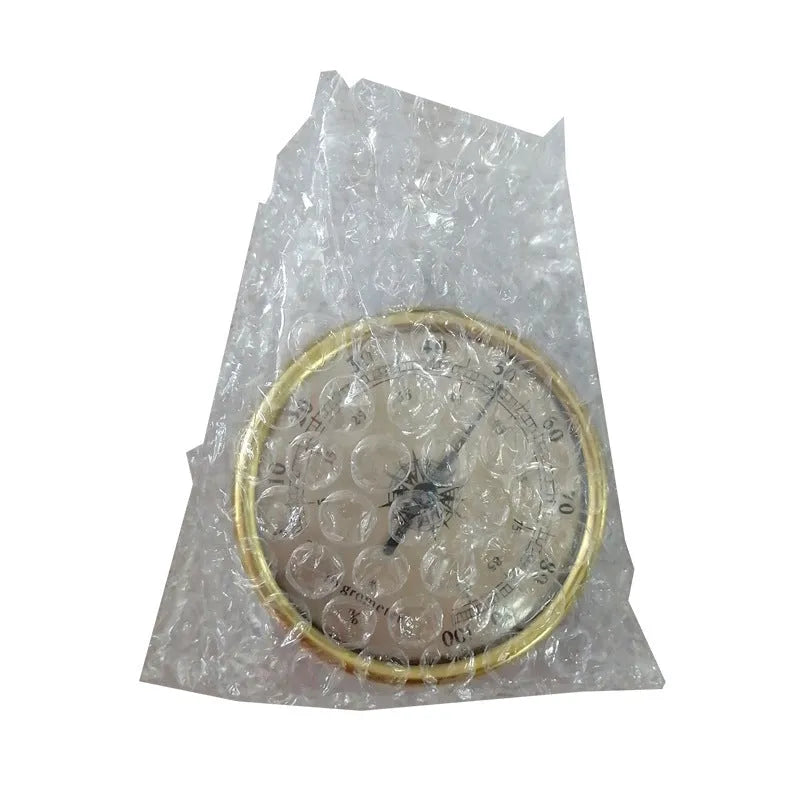 Silver aluminium analog thermometer and hygrometer on a white background.