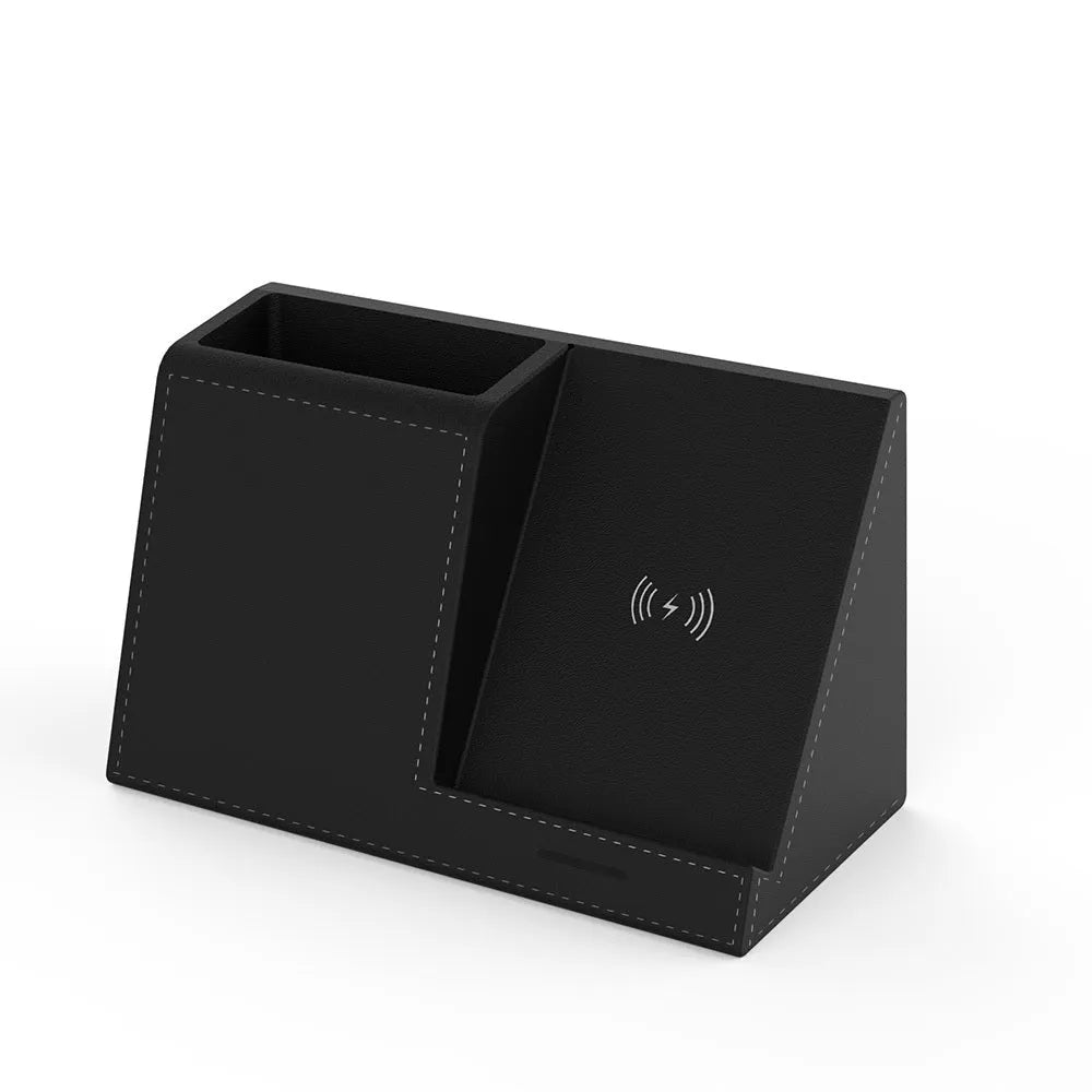 Black leather desk organiser with pen slots and a wireless phone charging pad on top